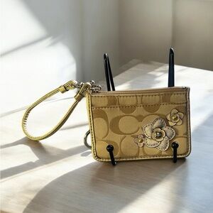 Coach Gold Clutch with Monogram Pattern